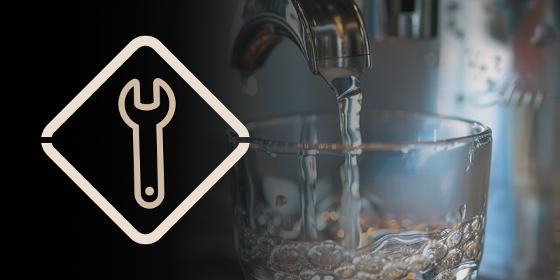 a close-up of a kitchen faucet with a wrench icon indicating maintenance tools leaking water in a modern setting essential plumbing for home repairs